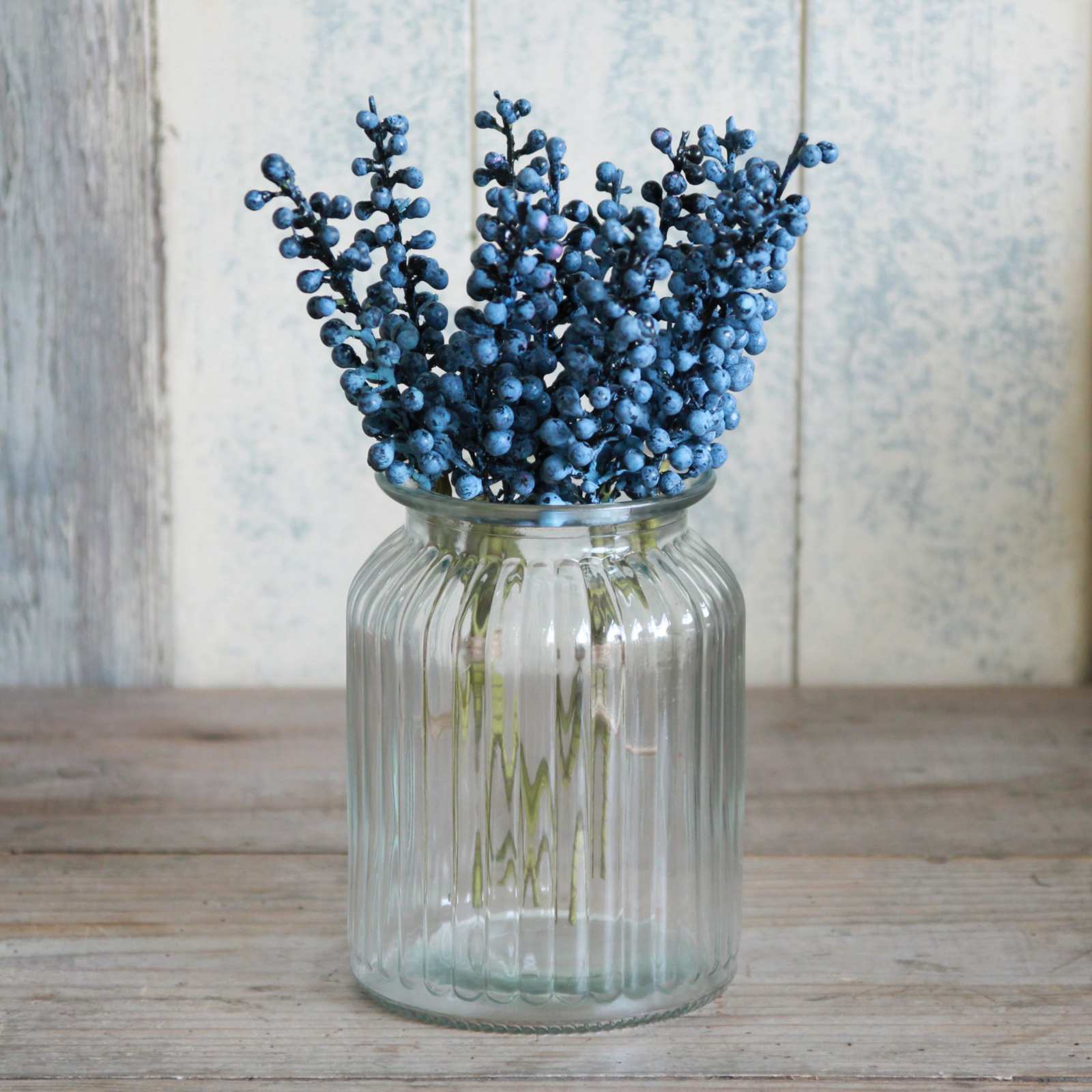 Ribbed jar vase with berries