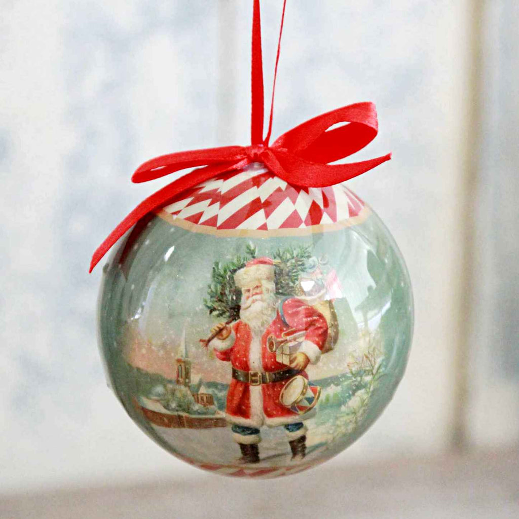 Nostalgic vintage Santa paper bauble with red hanging ribbon.