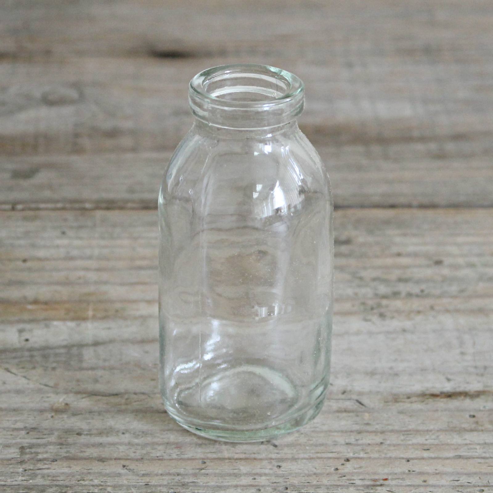 Mini milk bottle, lovley to use as a little milk jug, or perfect for a sprig of flowers