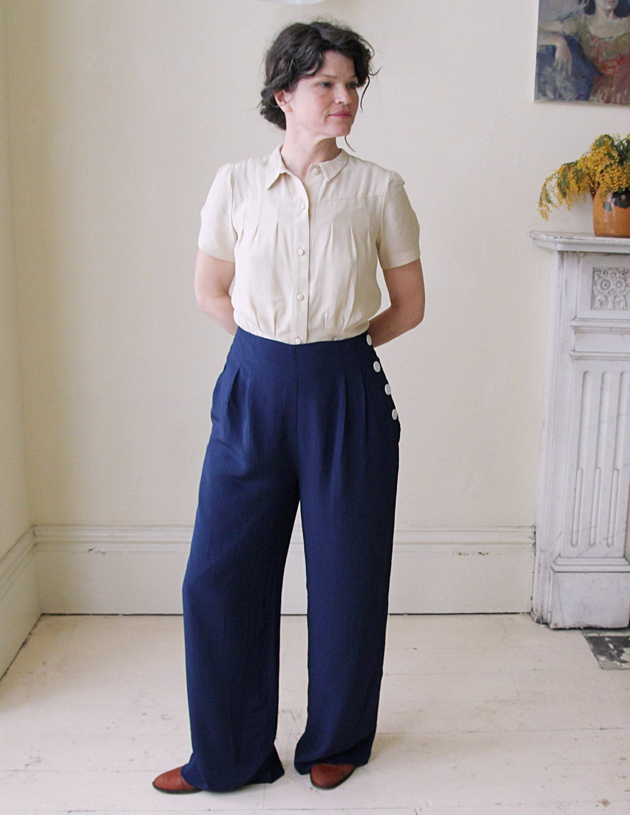 Classic 1940's high waisted, wide legged vintage trousers with white buttons down one side