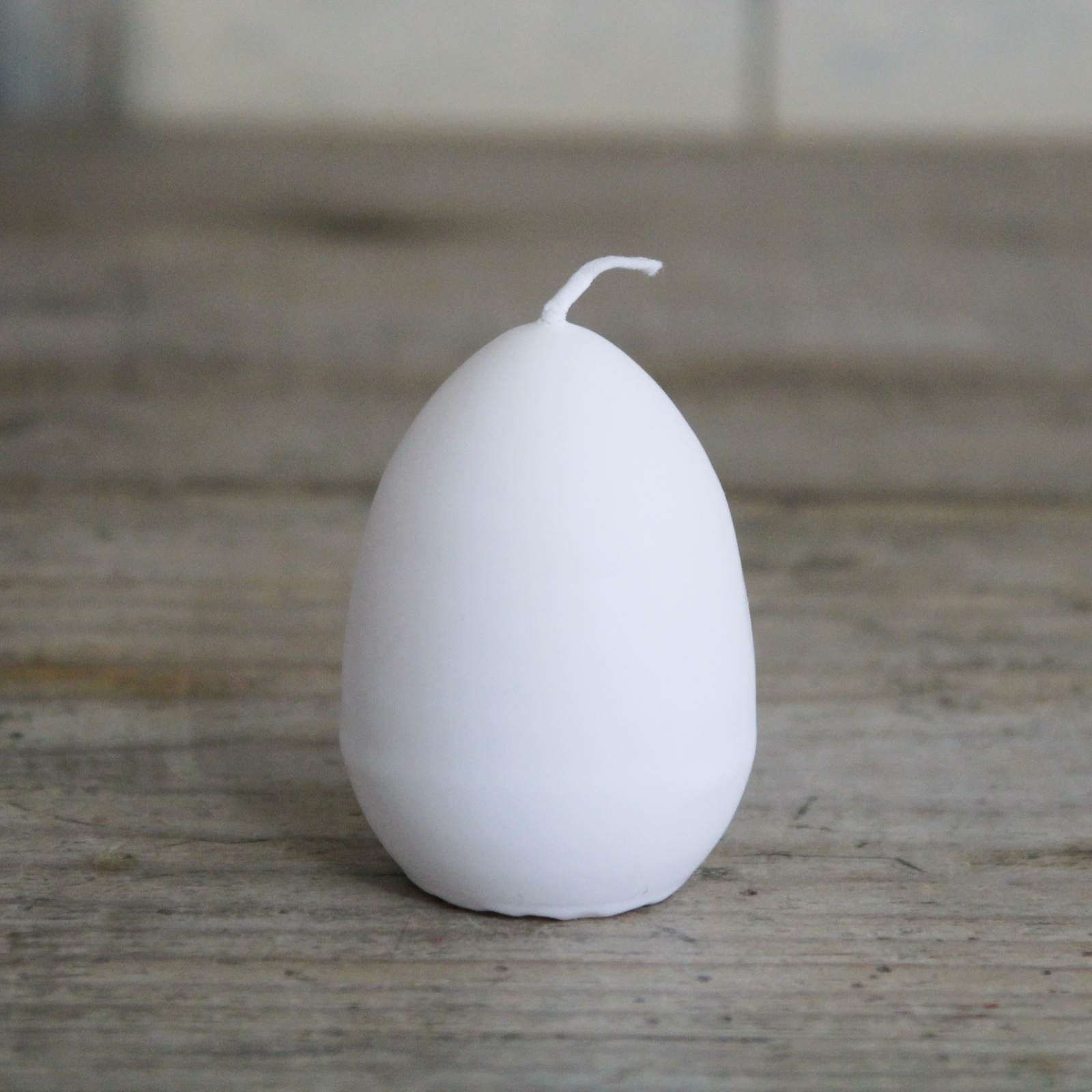 Egg Candle - White egg shaped candle with a yellow interior