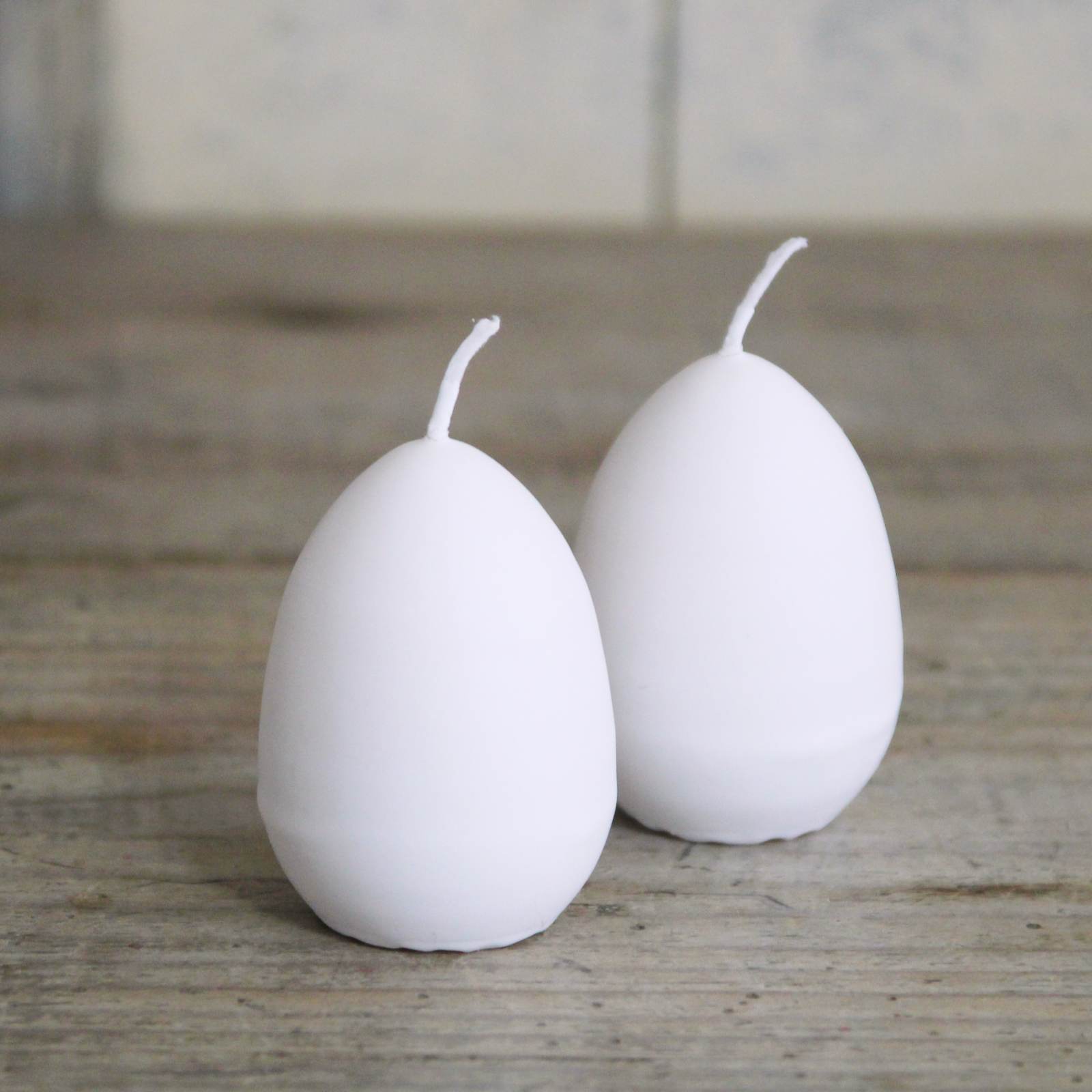 Egg Candle - White egg shaped candle with a yellow interior